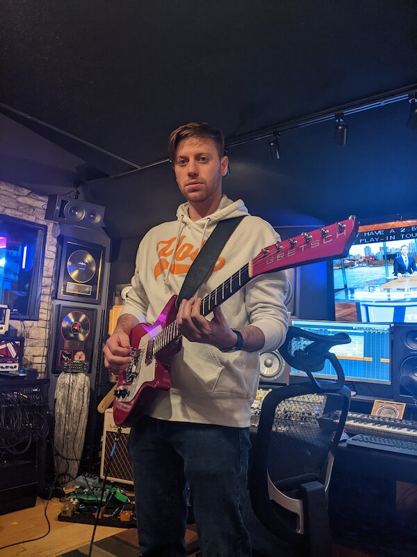 Reed playing guitar at Lakeside Studios